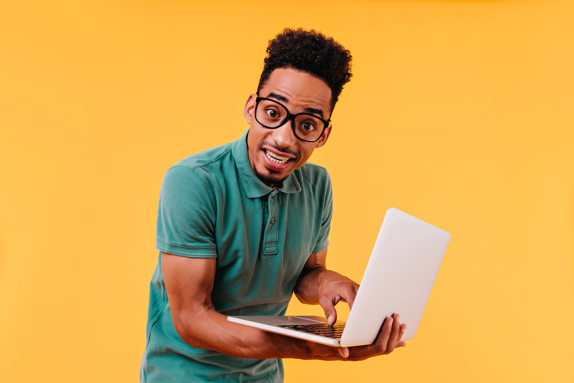 Dark Eyed International Student Posing With White Laptop Indoor Photo Male Freelancer Typing Keyboard